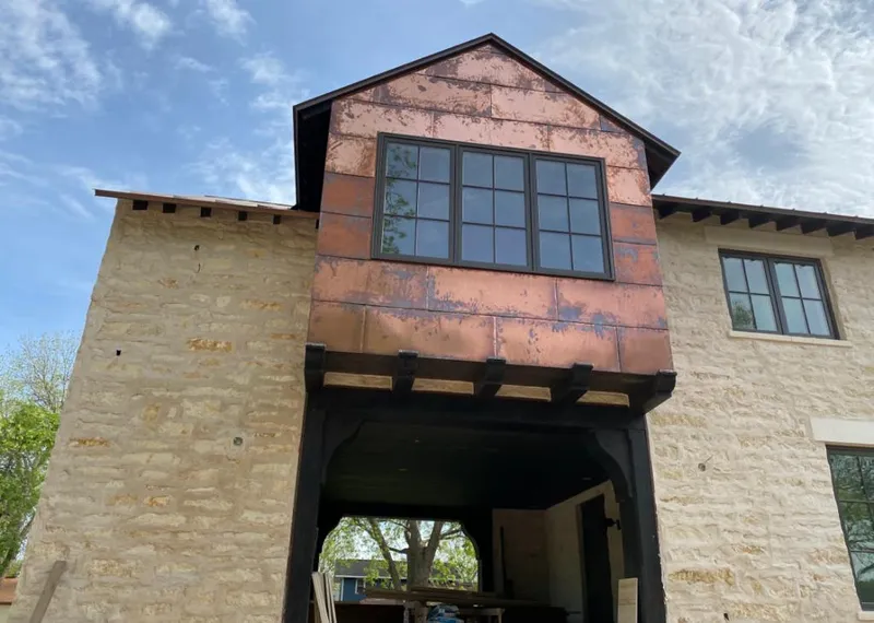 Copper metal panel facade on a stone building for Metal Roof Coating in Rushville